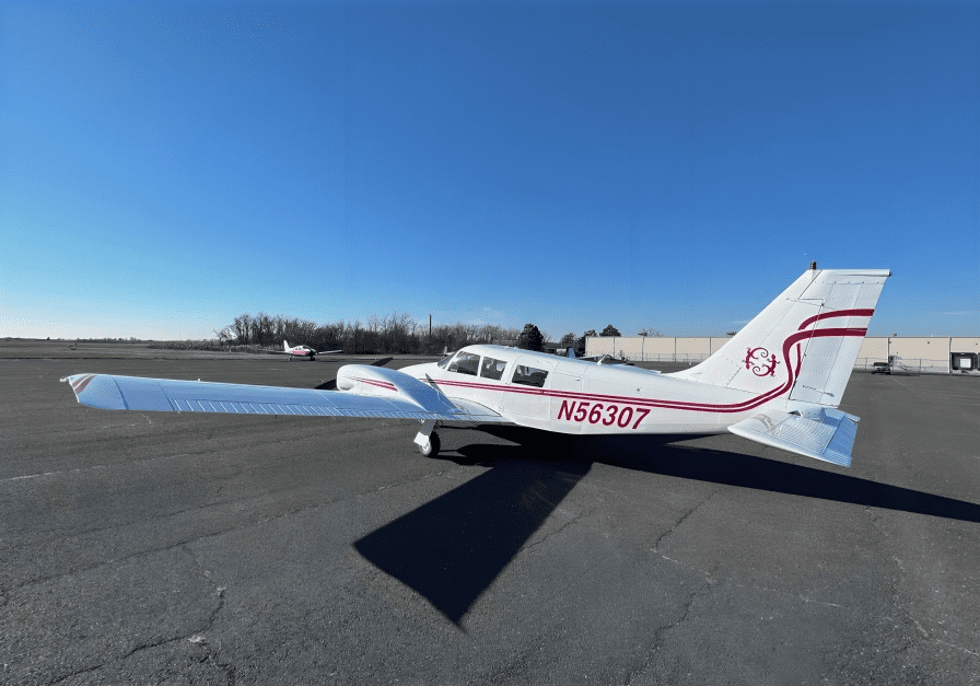 Small aircraft parked on an empty tarmac.